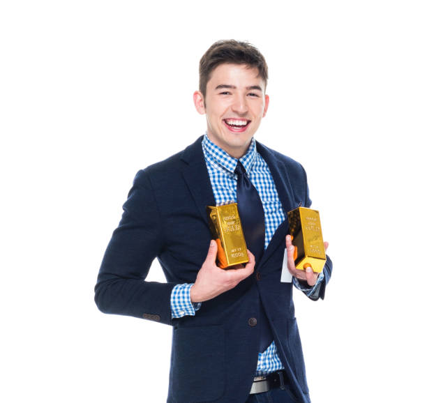 Happy guy holding a gold bar